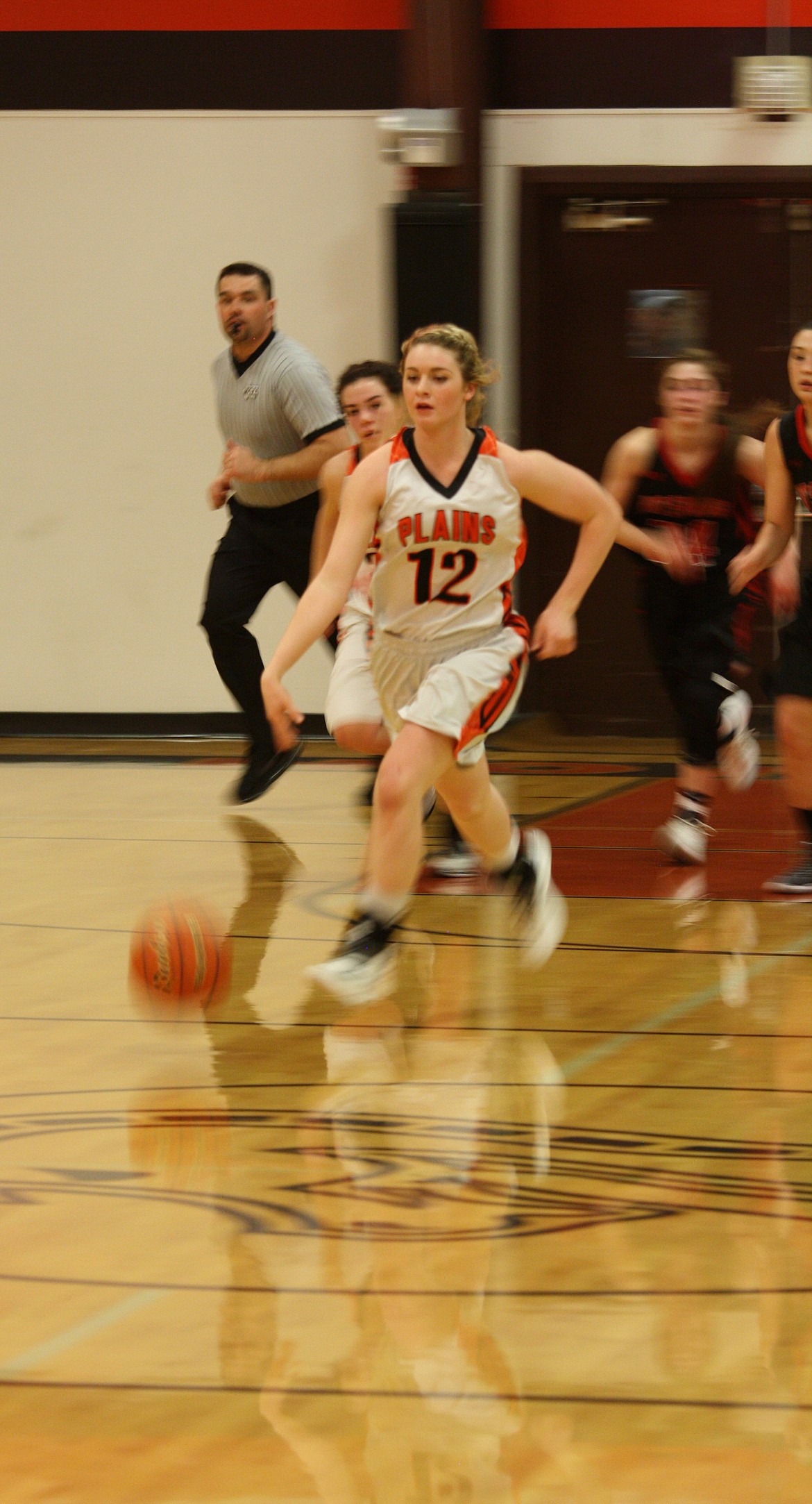 LINDSAY LAWS (12) leaves several of the Lady Savage Heat players trailing as she moves down the court. (Douglas Wilks photos/Clark Fork Valley Press)