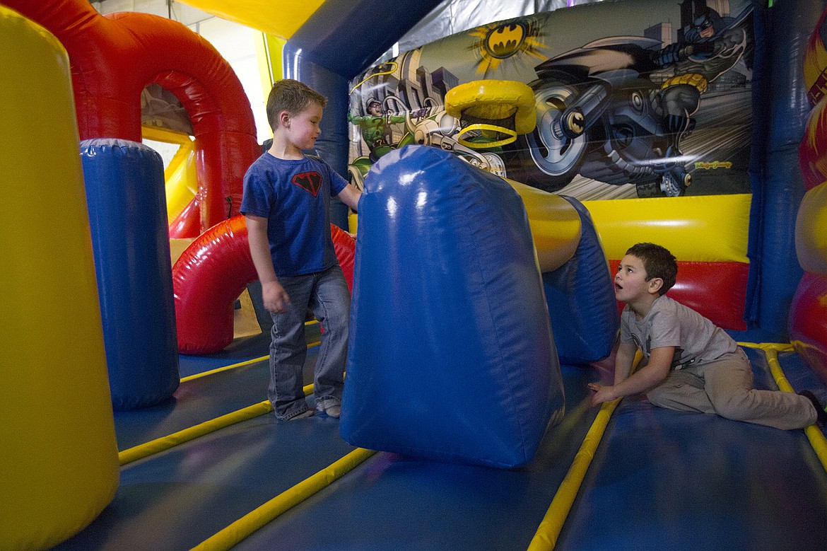 LISA JAMES/ Press
Tyce Fuqua, 5, left, plays with a friend at his superhero themed celebration at Jump for Joy in Coeur d'Alene last Thursday night, which was Tyce's last day of chemotherapy. About 100 friends and family members joined Tyce to mark the end of his 3 years and 3 months of leukemia treatment.