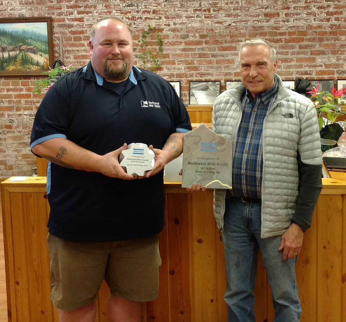 Northwest Mine Supply sales manager Chad Jefferson (left) and owner Don Berger show off their 2015 and 2016 Atlas Copco Top Secoroc Drilling Tools Distibutor awards.