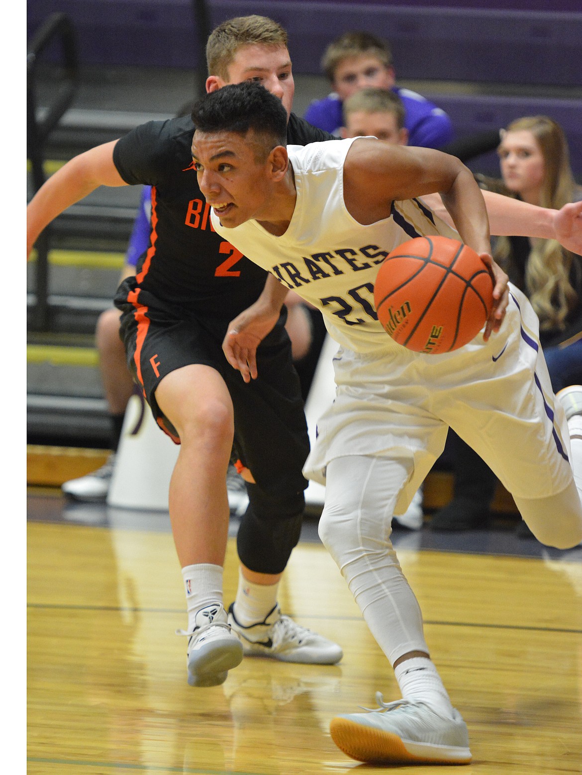 POLSON PIRATES guard Jayden Batista (20) drives the lane in the fourth quarter against Frenchtown Thursday night at Linderman Gym. (Jason Blasco/Lake County Leader)