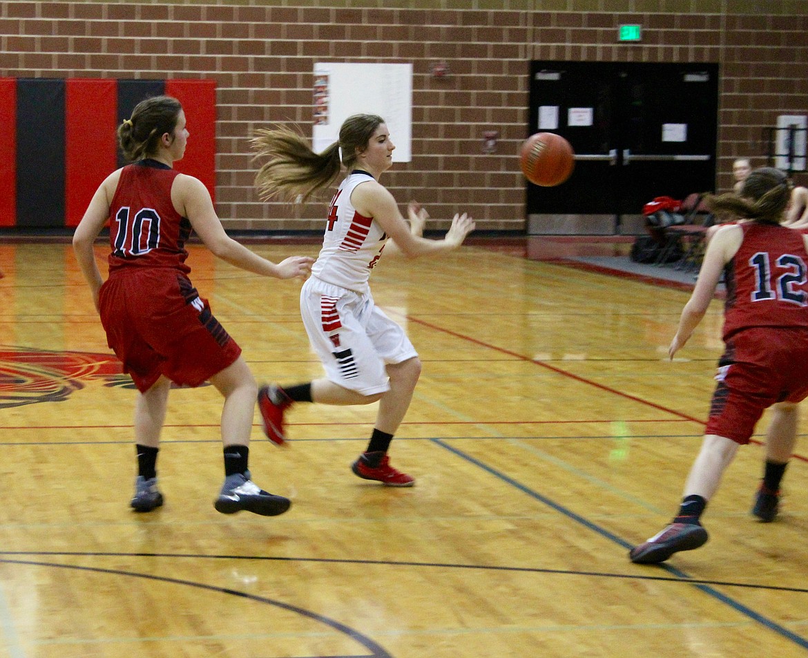 Sierra Brantz passes the ball at the top of the 3-point line to set up the Miners&#146; attack.