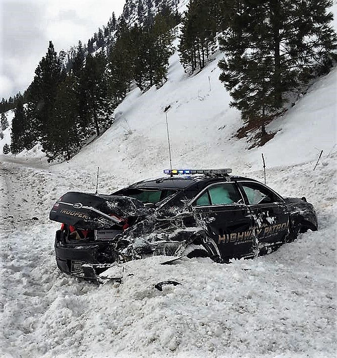 Montana Highway Patrol Trooper Jordon Gulick narrowly escaped injury when a semi-truck struck his patrol car while investigating an accident near Alberton on Jan. 18. (Courtesy Montana Highway Patrol).