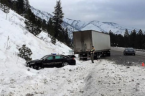 A Freightliner truck struck a patrol car on I-90 while Trooper Jordon Gulick investigated an accident on I-90 near Alberton on Jan. 18.(Photo courtesy Montana Highway Patrol).