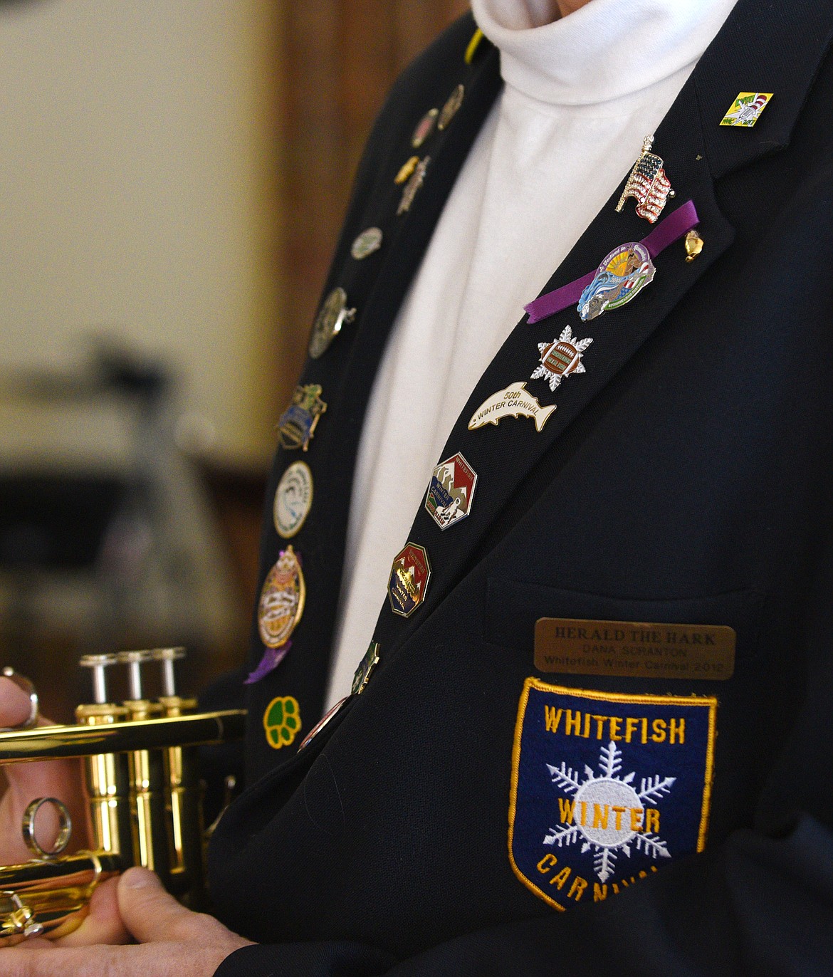 PINS FROM past Whitefish Winter Carnivals line Dana Scranton&#146;s blazer.