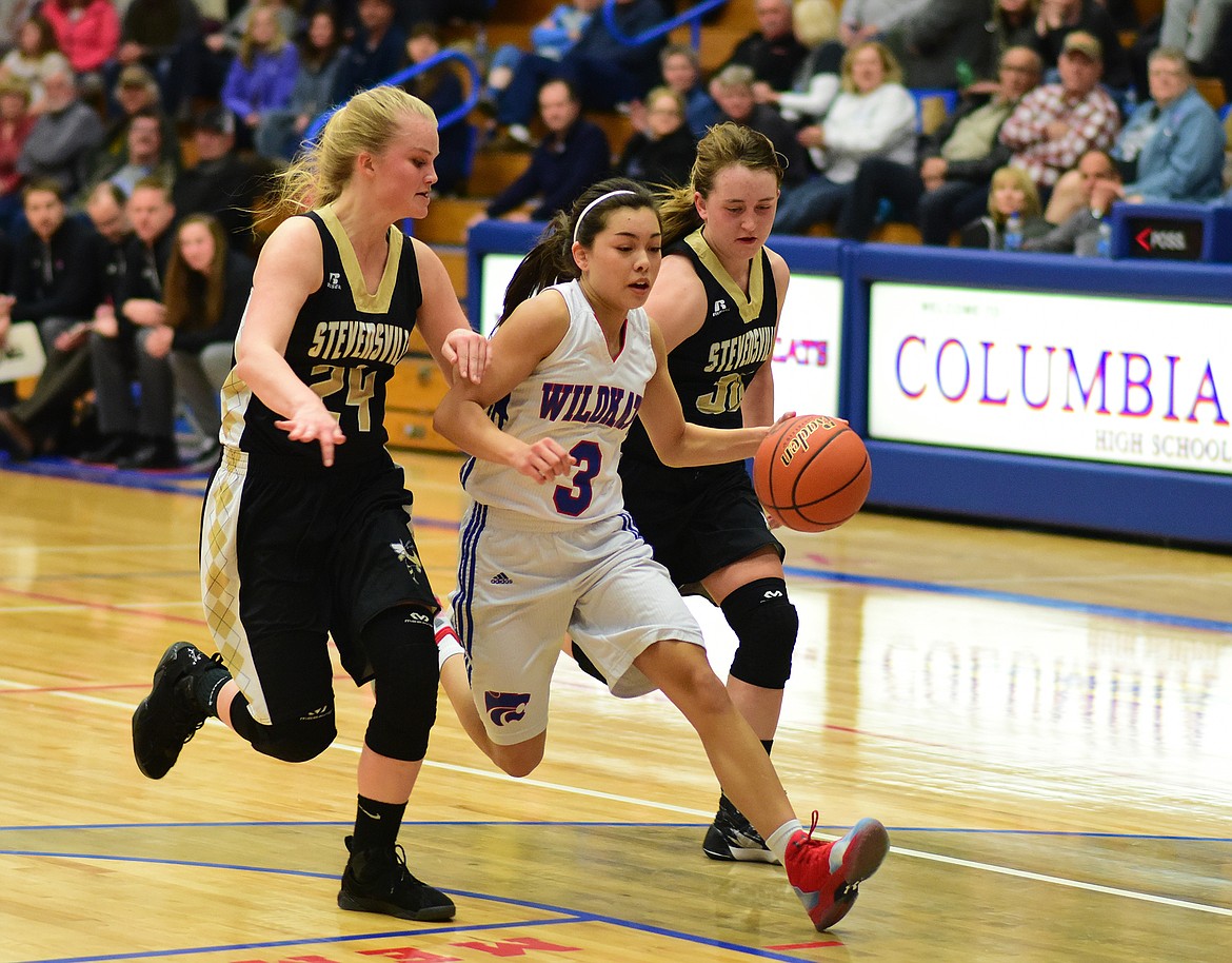 Dani Douglas races down court after making a steal against Stevensville.