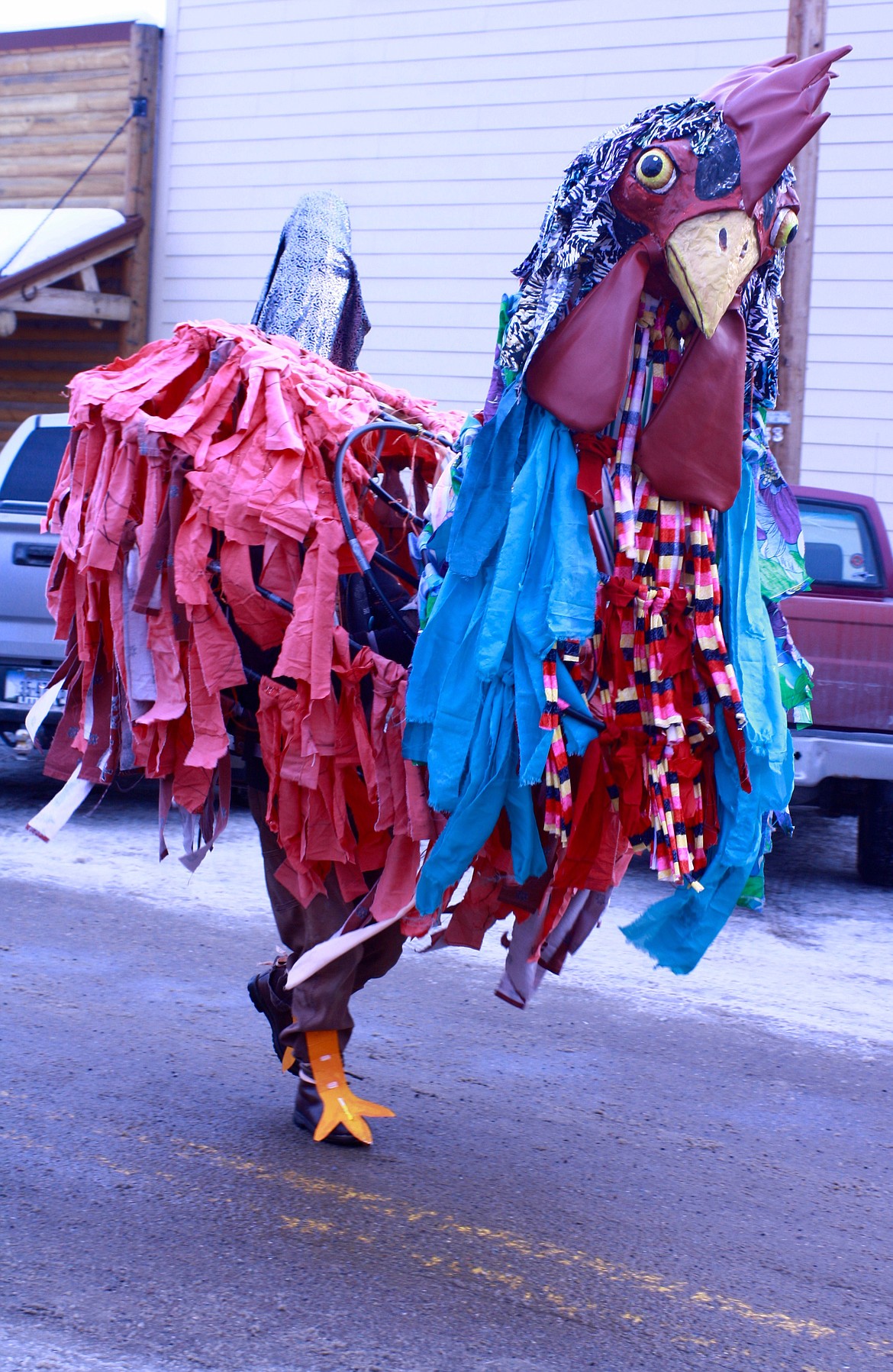 A LARGE rooster (John Erdman) makes an appearance at the Chinese New Year parade in Hot Springs.