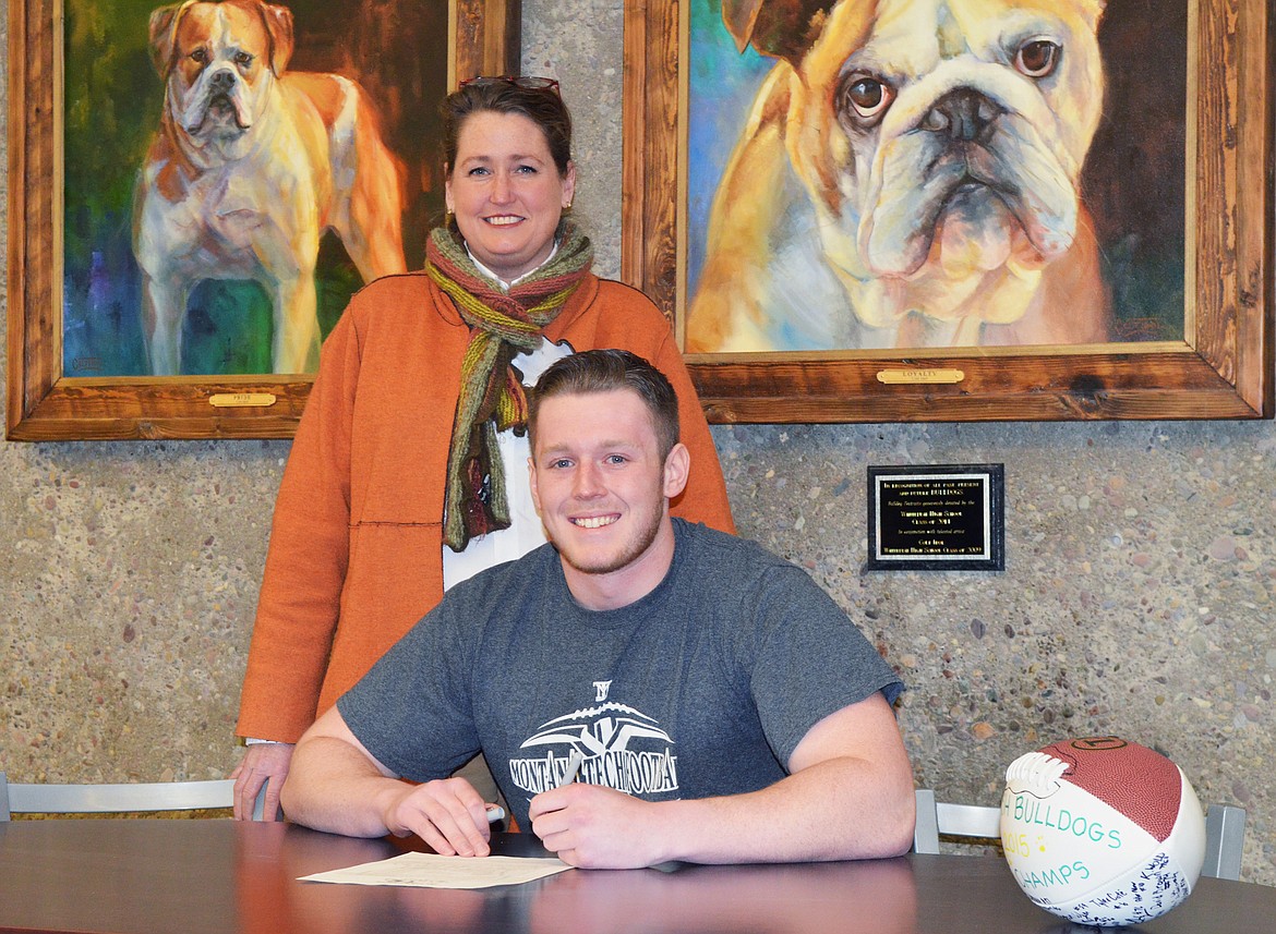 Patrick McGeady signs a letter of intent to play defensive end for Montana Tech.