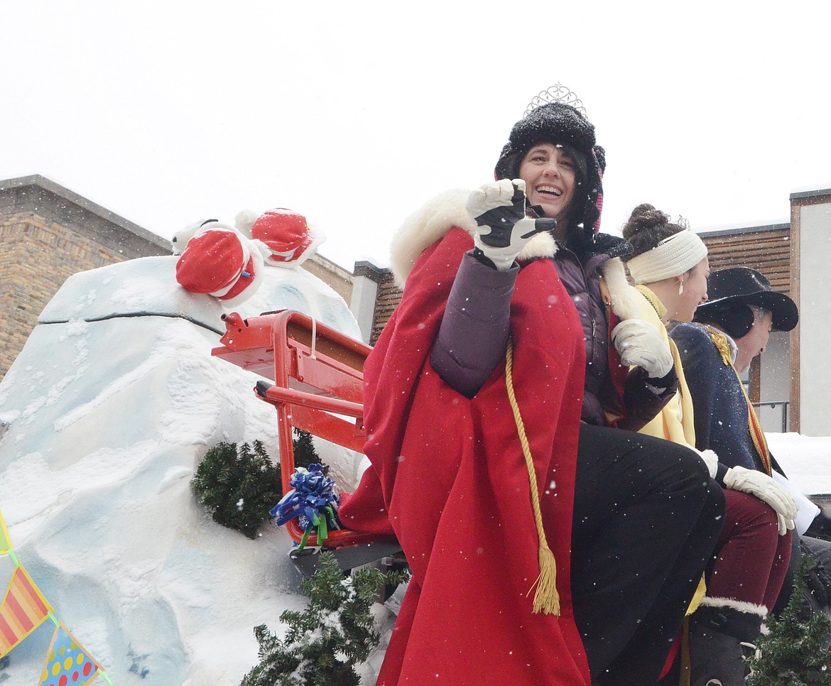 Queen of the Snows Sue Strauser waves to the crowd on Central Avenue Saturday during the 58th annual Whitefish Winter Carnival Grand Parade. This year&#146;s theme was &#147;One Fish, Two Fish, Whitefish&#148; a nod to the many colorful Dr. Seuss children books. (Heidi Desch/Whitefish Pilot)