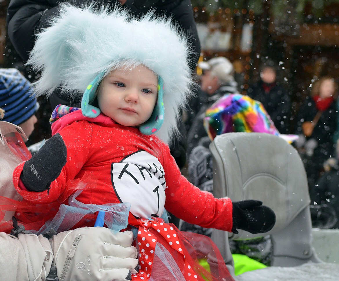 A youngster rides on the North Valley Music School float Saturday during the 58th annual Whitefish Winter Carnival Grand Parade. This year&#146;s theme was &#147;One Fish, Two Fish, Whitefish&#148; a nod to the many colorful Dr. Seuss children books. (Heidi Desch/Whitefish Pilot)