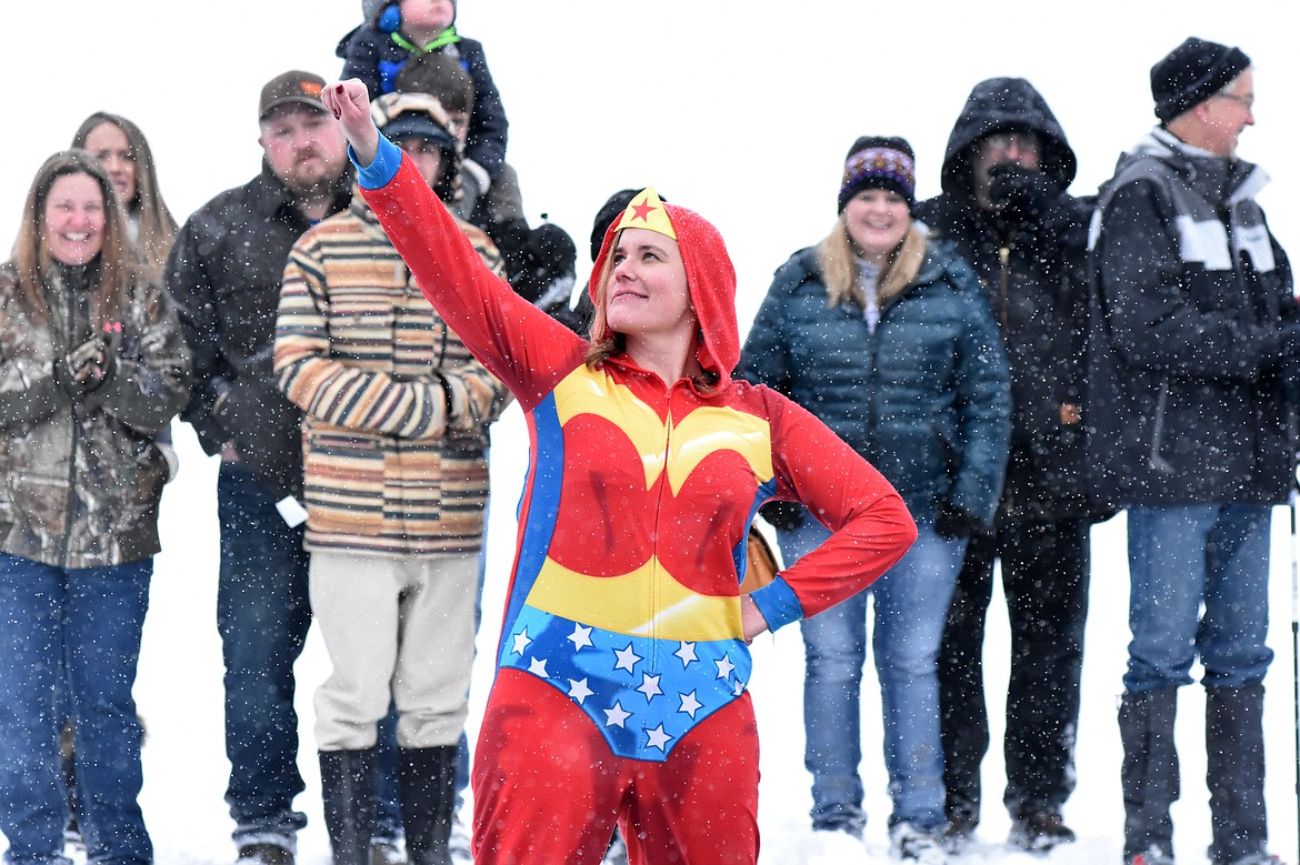 Wonder Woman strikes a pose before jumping into Whitefish Lake Saturday morning during the annual Penguin Plunge at City Beach. The event raises money for Special Olympics Montana. (Heidi Desch/Whitefish Pilot)