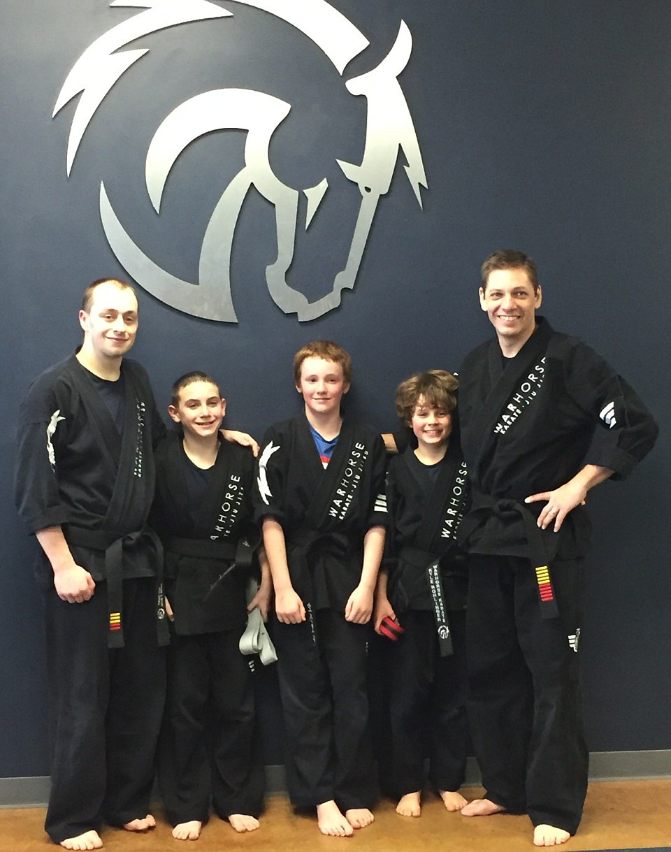 Courtesy photo
Three students of Warhorse Karate in Post Falls earned their black belts after training for more than five years to achieve the goal. From left are Mr. Tommy Salsby, Ronan Blackburn, Matthew Carr, Kyle Rohlinger and Master Damon Tong.