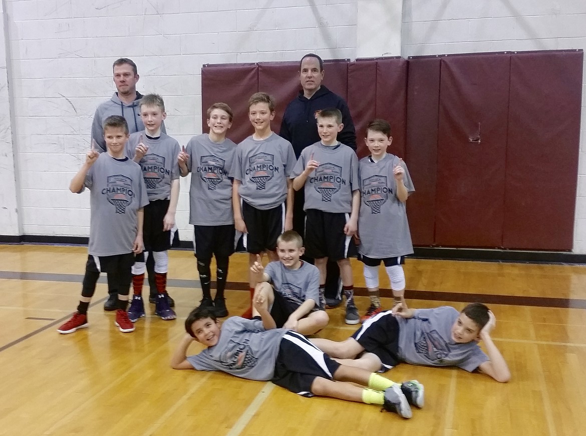 Courtesy photo
The Running Rebels fifth-grade boys basketball team went 4-0 to win the championship this past weekend at the Moses Lake Desert Hoop Classic. Laying down from left are Tyler Engelson and Alex Shields; sitting is Dylan Magsano-Wolfe; standing from left are Peyton Hollenbeck, Justice Smith, Troy Ostlund, Aaron Moulson, Austin Rutherford and Steven Anderson; and in the rear, coaches Brett Hollenbeck and Wade Engelson.