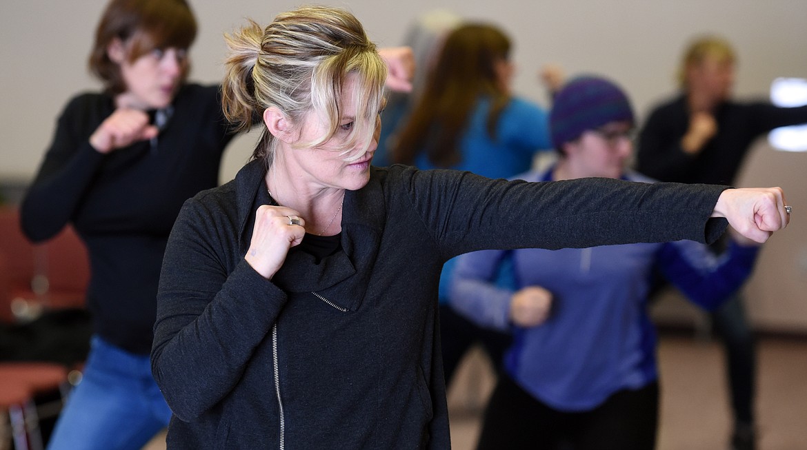 Heidi Hickethier takes part in the abbreviated boxing training with Garret Garrels on Friday, February 3, at Flathead Valley Community College.(Brenda Ahearn/Daily Inter Lake)