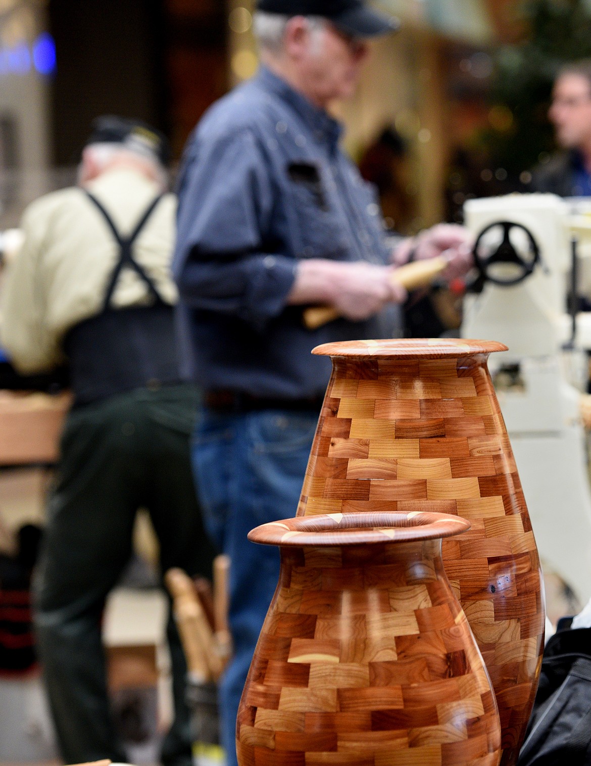 VASES MADE by Joe Bowers on display Saturday. The large vase is made from red cedar and redwood and is comprised of 271 pieces.