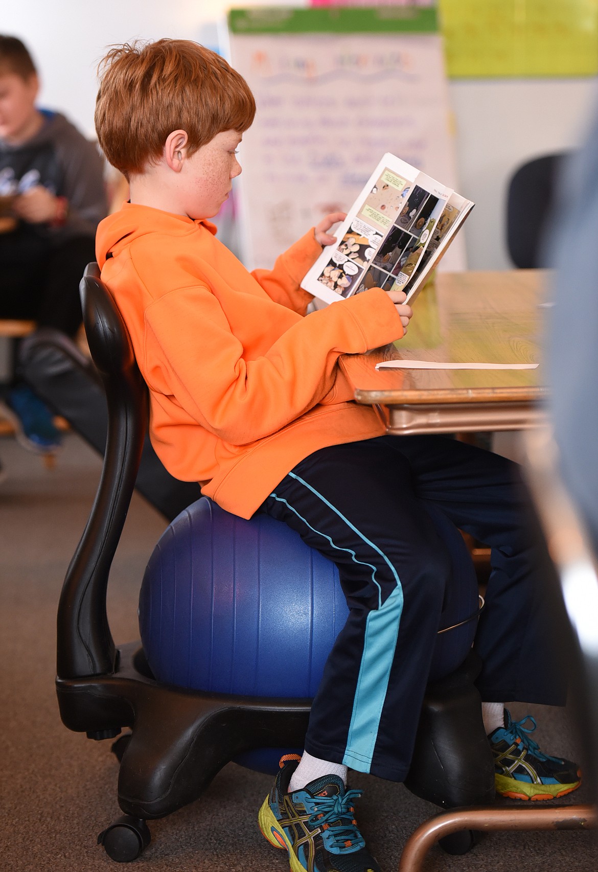 HARRY TRUFANT sits on a ball chair during reading time in Watson&#146;s class.