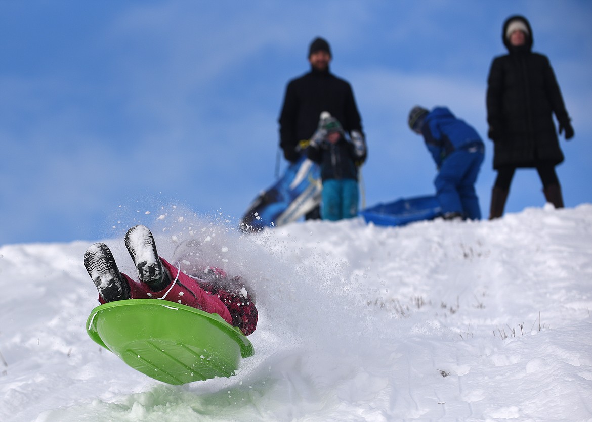 A YOUNG sledder hits a jump at Dry Bridge Park in Kalispell in December. (Aaric Bryan/This Week in the Flathead)