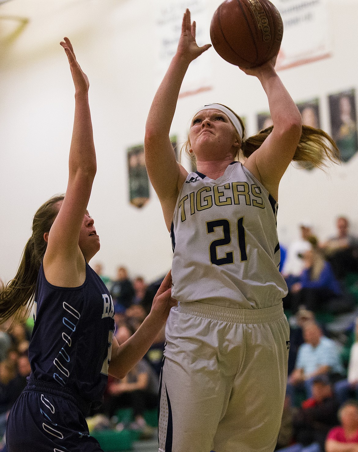 LOREN BENOIT/Press
Timberlake senior Glori Cheevers (21) shoots against Elisabeth Cowley of Bonners Ferry in the 3A District 1 championship game Friday night at Lakeland High School.