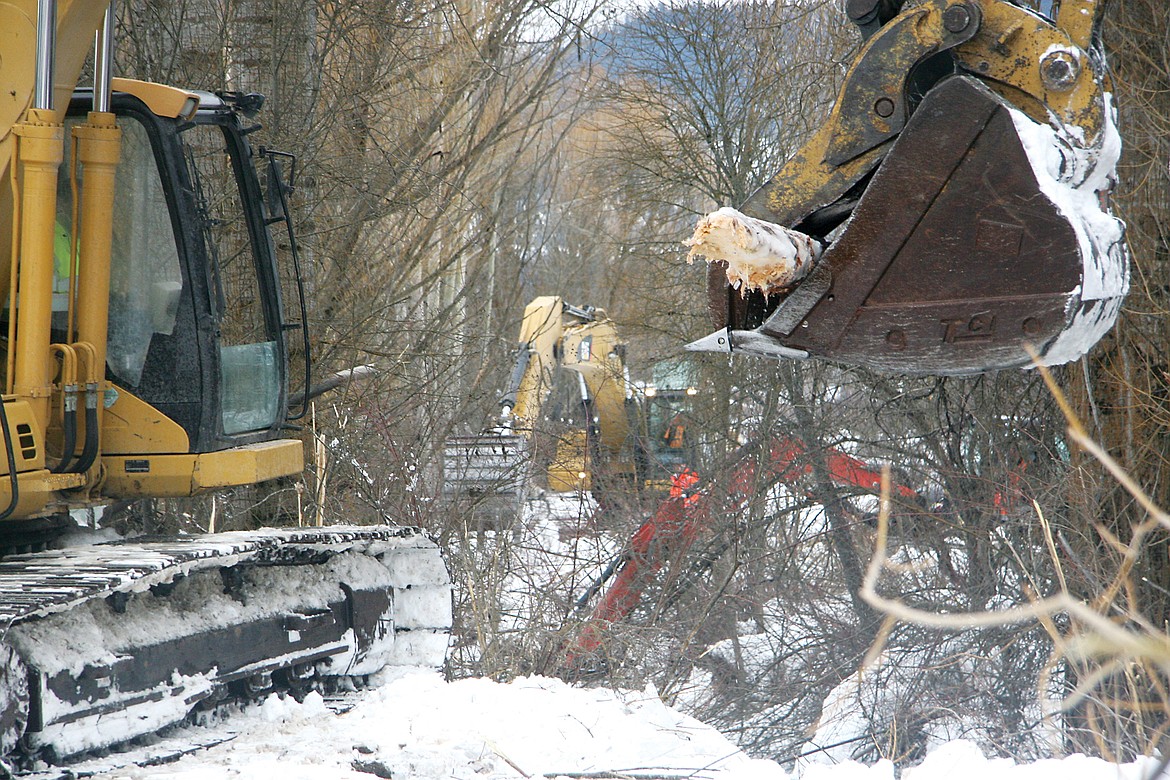 Four excavators sat parked along Flower Creek on Wednesday next to the City Service Road on the Northwest part of town. (Bethany Rolfson/TWN)