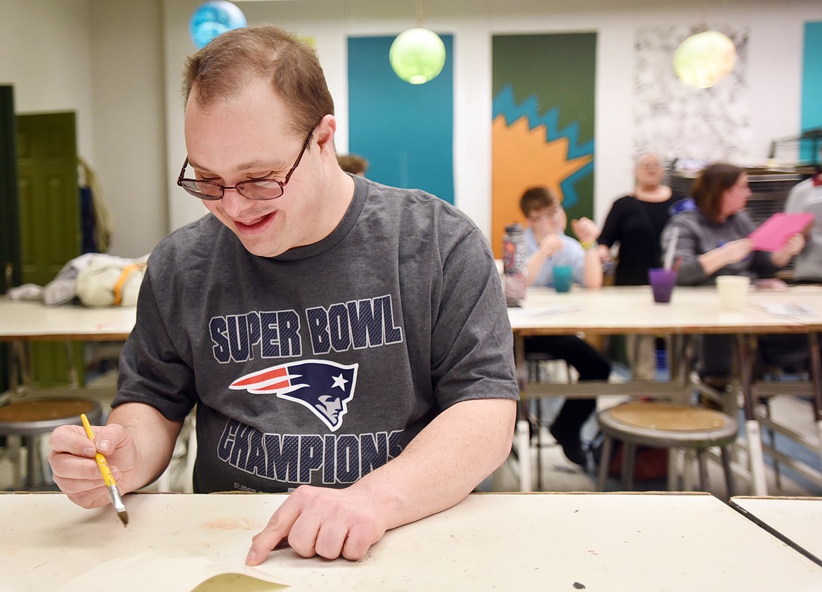 Jeremy Minnehan makes a Valentine&#146;s Day card with the Flathead High School Art Club on Monday. Today the cards will be distributed to seniors at Heritage Place. (Brenda Ahearn photos/Daily Inter Lake)