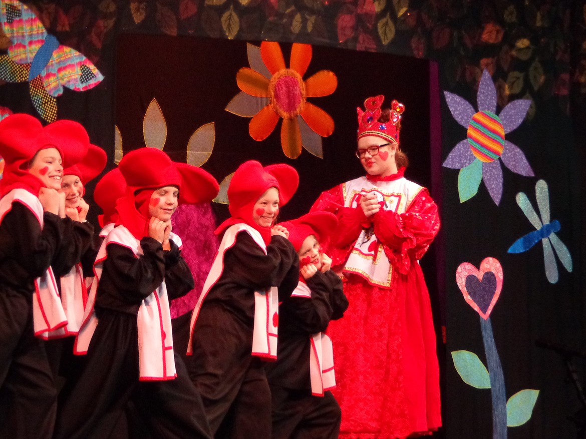 Charles H. Featherstone/Columbia Basin Herald
Red Queen Abigail Dale listens to the pleas of the pack of cards who follow her.