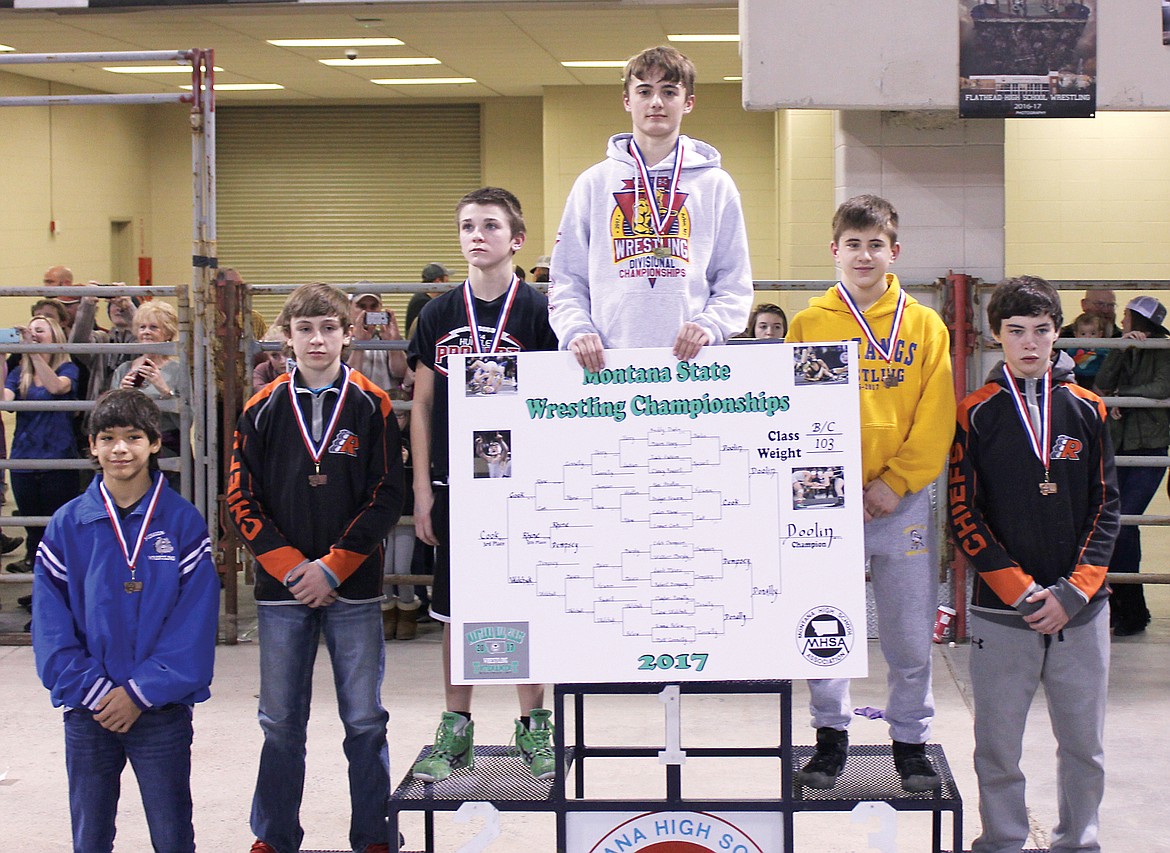 State Championship wrestler Buddy Doolin high atop the podium.