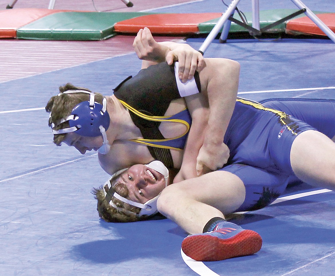 Senior Dylan Parrish pinning his opponent, state wrestling championships Feb. 10.