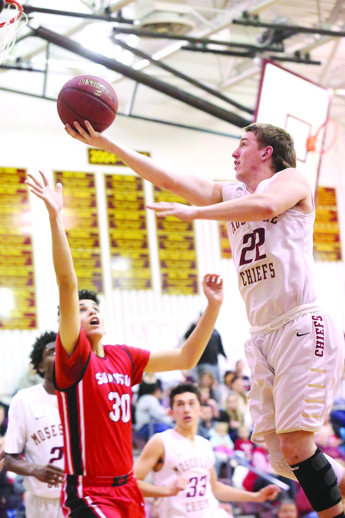 Connor Vanderweyst/Columbia Basin Herald
Moses Lake guard Zach Phillips scores two of his 28 points Tuesday against Sunnyside.