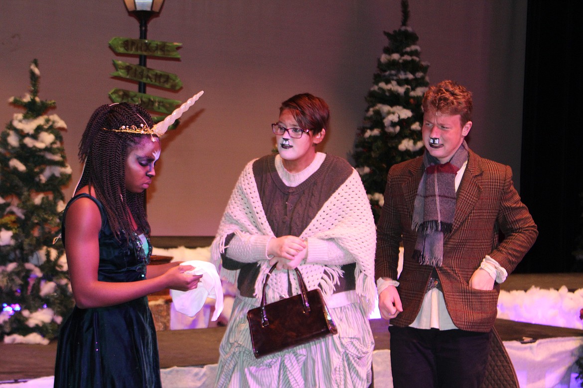 Cheryl Schweizer/Columbia Basin Herald
The unicorn (Obi Aboyni, left) and Mr. and Mrs. Beaver (Canon Gregoire, right, and Olive Carrell, center) puzzle over a clue left behind in Narnia in the MLHS production of &#147;The Lion, the Witch and the Wardrobe,&#146; opening Thursday.