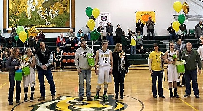 Senior Night was held in St. Regis on Saturday.  Three senior athletes were escorted onto the gym floor with their parents. (Photo courtesy of the St. Regis Fan Club Facebook).