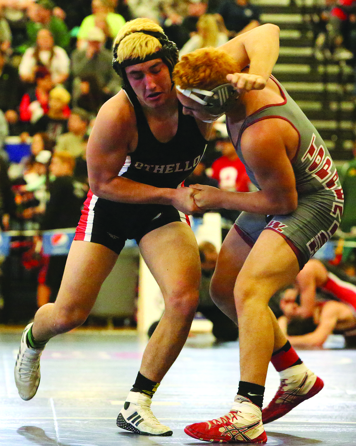 Connor Vanderweyst/Columbia Basin Herald
Othello's Reese Jones (left) gets tied up with Toppenish's Keyano Zamarripa.