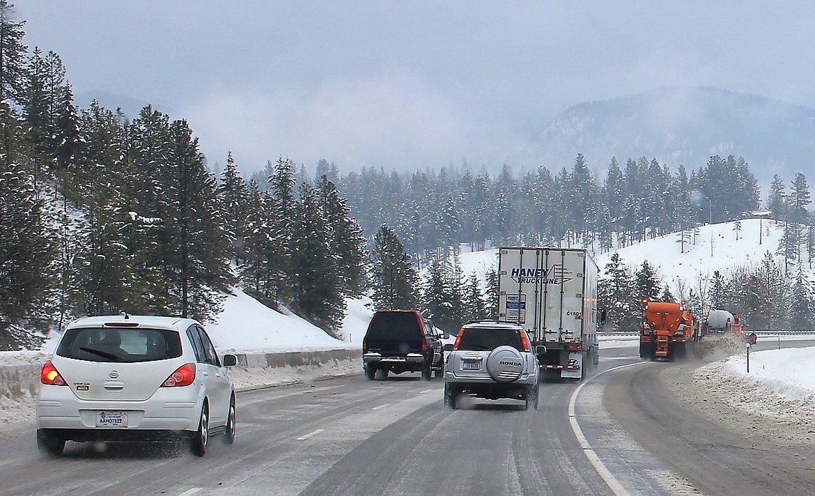 Snow plows and deicers block traffic on Interstate 90 as snow and slush accumulated while temperatures rose on Thursday. Severe weather conditions caused 47 accidents between Feb. 6 and Feb. 11. (Kathleen Woodford/Mineral Independent).