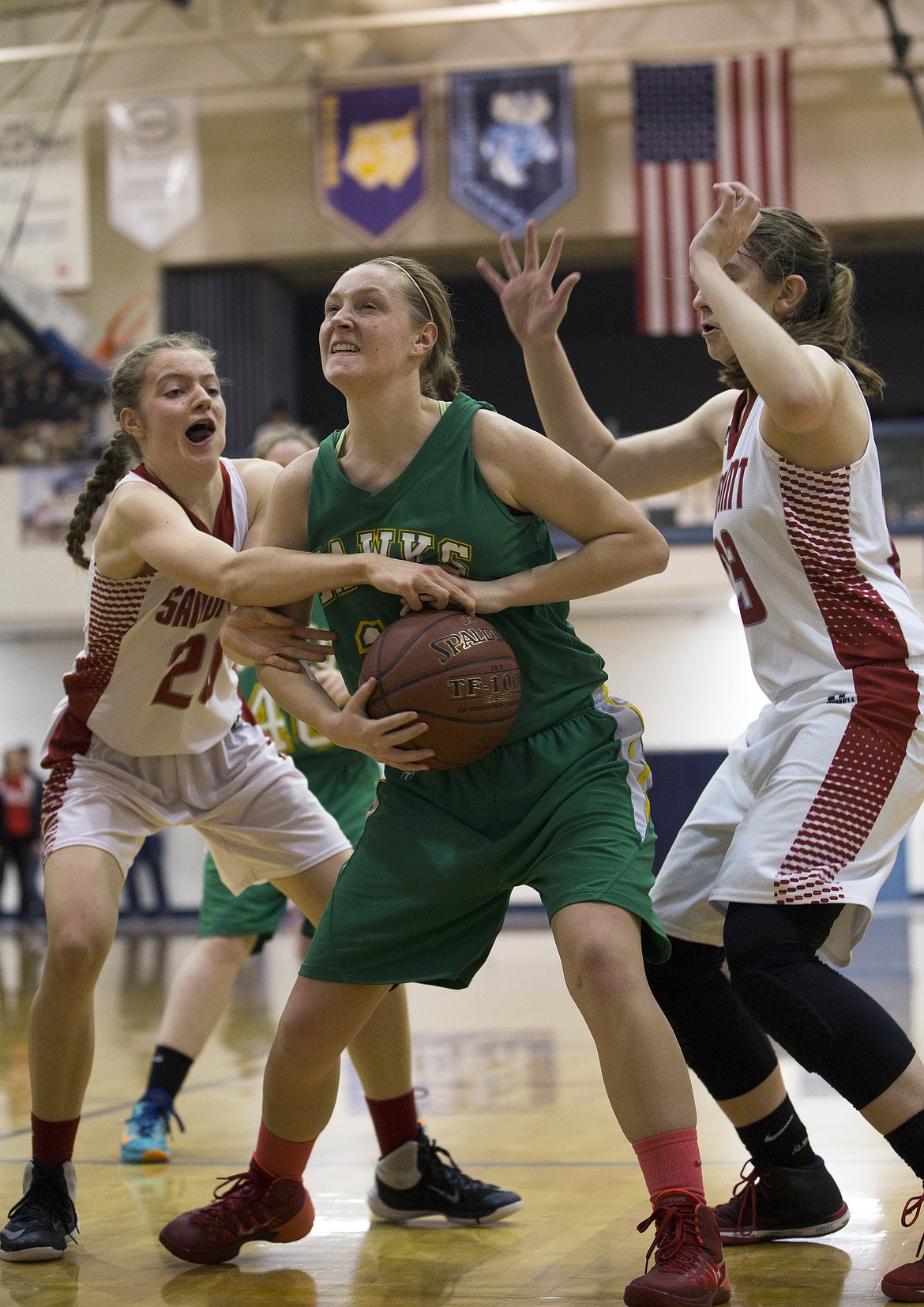 Taylor Ward, left, of Sandpoint, tries to get the ball from Makenzie Edinger, center, of Lakeland as Trinity Golder, right, defends during their 4A Region 1 girls basketball championship game at Timberlake High on Thursday night.

LISA JAMES/ Press