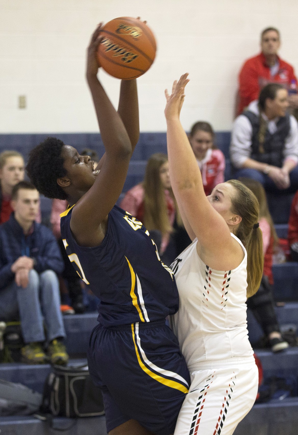 LISA JAMES/ Press
Bella Murekatete, left, of Genesis Prep, passes as Lillian Rhea of Lakeside defents during the first half of their 1A Division II District 1 girls basketball championship game at Timberlake High on Thursday night.