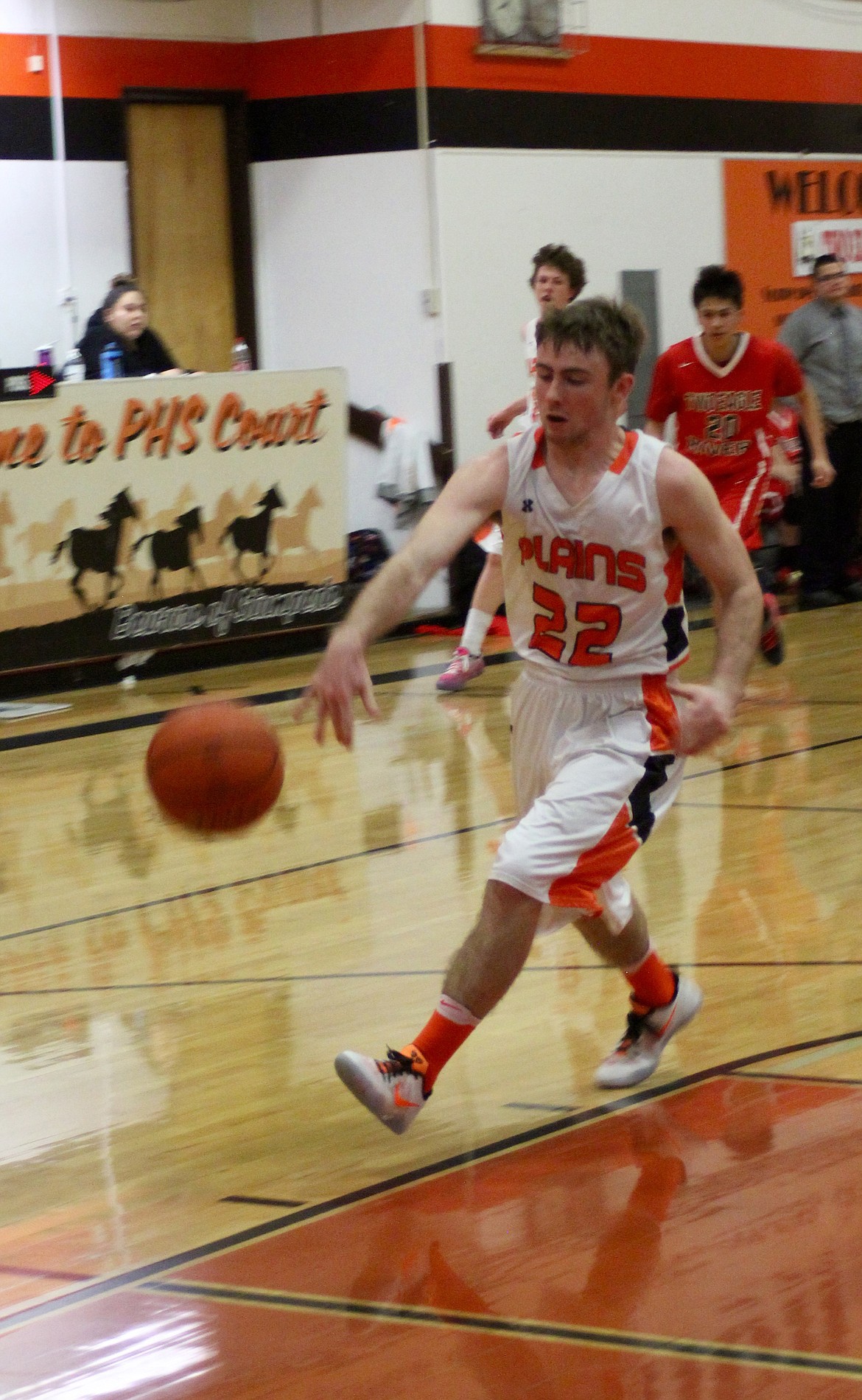 Tanner Ovitt (#22) moves closer to the basket as Two River Eagles (#20) Brendan McDonald attempts to catch up.