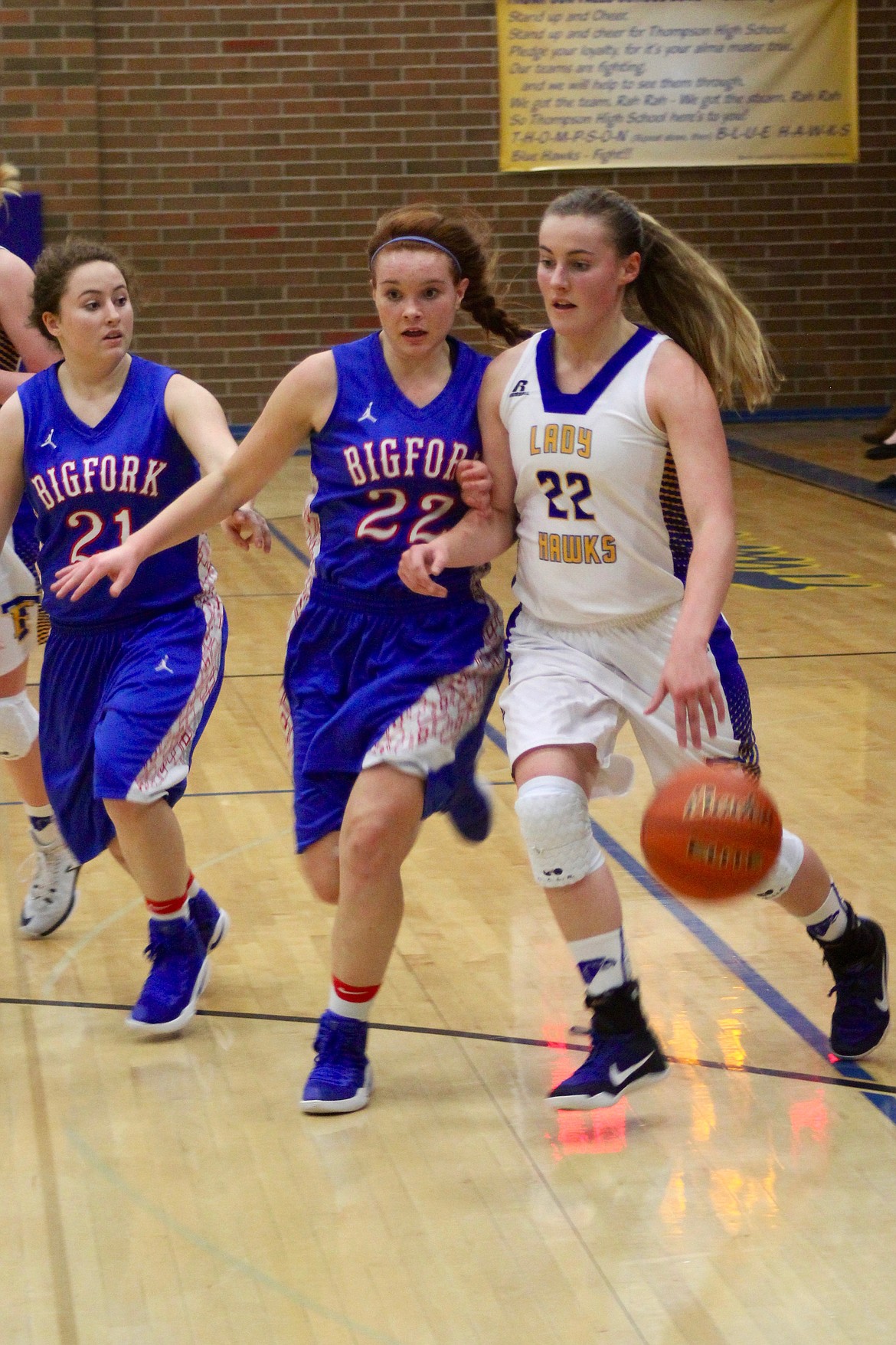 Thompson Falls Lady Hawks (#22) Haley Morgan finds herself being very closely guarded by two Bigfork players.