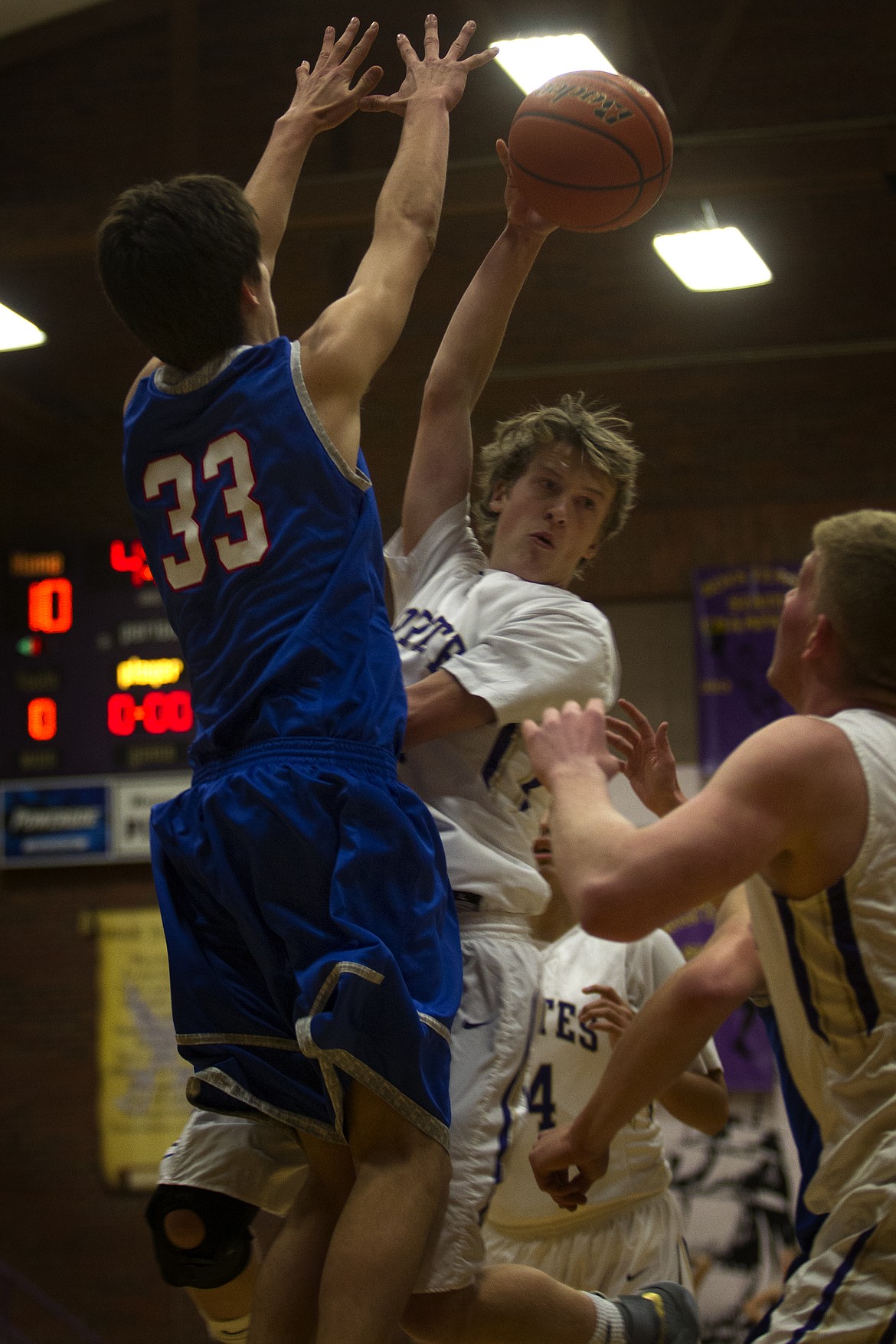 PIRATE FORWARD Connor Lanier passes the ball to Matthew Rensvold during action against Bigfork last week. The Pirates won the game, 62-34. (Jeremy Weber/Lake County Leader)