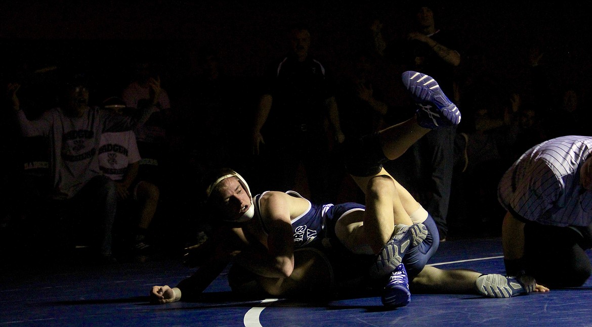 &#151;Photo by DAC COLLINS
Mason Eby, shown here pinning a Timberlake wrestler, was one of the Badgers to come out on top Tuesday night.