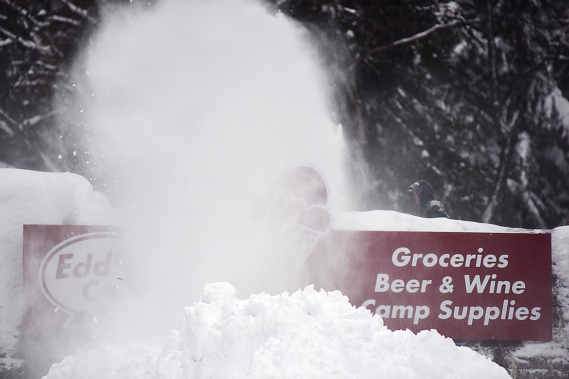 Gabe Salois uses a snowblower to clear off Eddie&#146;s Cafe in Apgar after a winter storm dumped about 36 inches of snow on West Glacier.