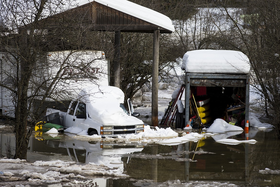 Photos by LOREN BENOIT/Press
Waters of the St. Joe River surround a truck and RV at a property near Calder Friday morning.