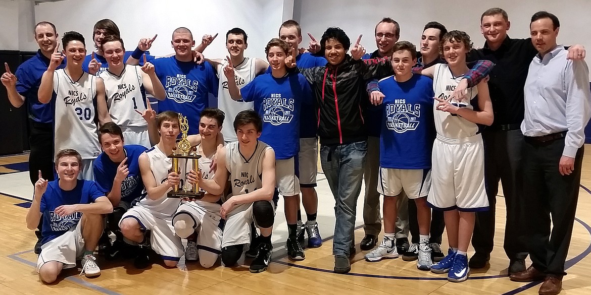 Courtesy photo
After going 14-0 in league and 25-2 overall, the North Idaho Christian School Royals boys basketball team won the Mountain Christian League tournament Feb. 10-11 in Pullman. The Royals, who went undefeated in league in 2015-16, repeated as tourney champs. In the front row from left are Eli Winde, Jordan Holmes, Nick Beck, Perrin Fish and Dillon Walker (second-team all-league); second row from left, Cross Pilgrim, Darian Kelly, Phil Connelly, Kobe Cottier, Jack Hill and James Kelly; and back row from left, head coach Nate Baughman, Riley Bailey, Allen Hunter, Brandon Schwintek (first-team all-league), Garrett White (first-team all-league), assistant coach Zach White, assistant coach Shawn Thompson and assistant coach James Noel.