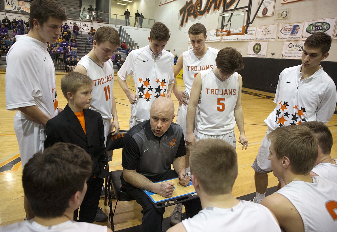 LISA JAMES/Press
Post Falls coach Mike McLean speaks to his players during the last minutes of the Trojans&#146; 5A Region 1 championship game against Lewiston at Post Falls High School last Tuesday night.