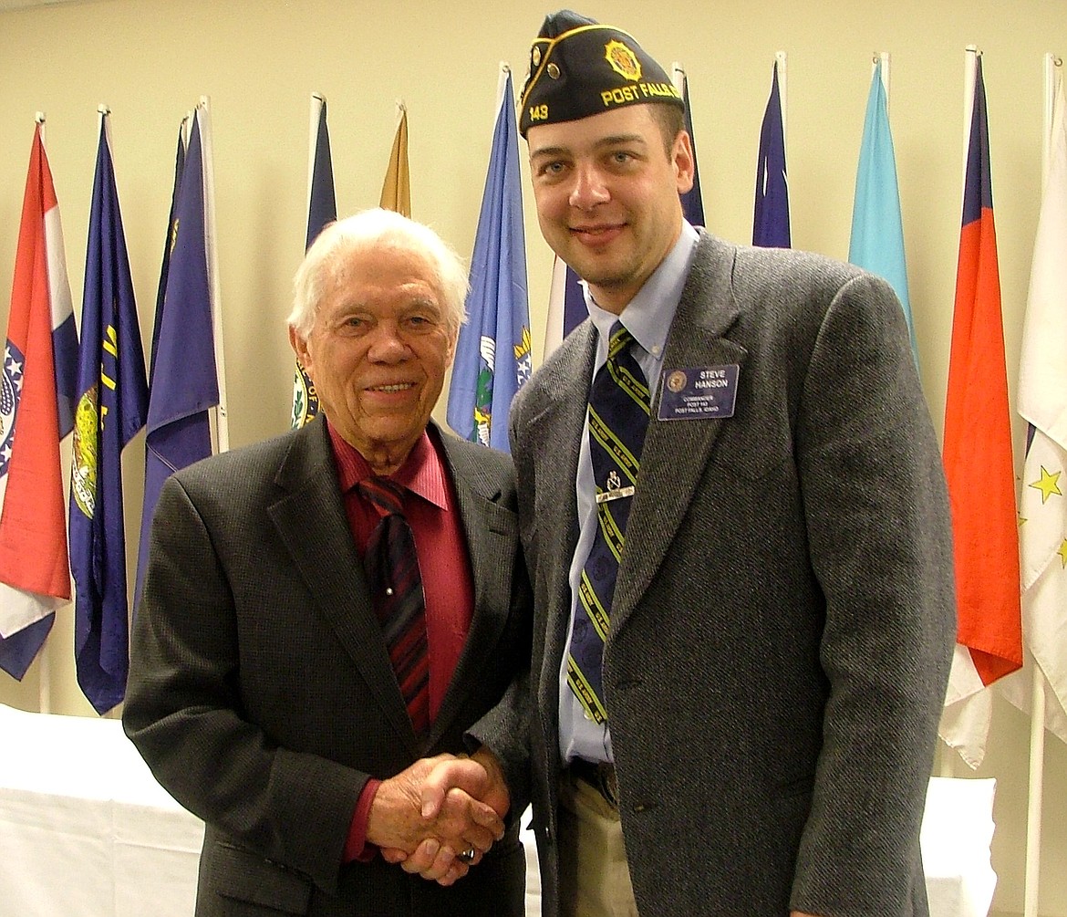 KERRI THORESON/For the Press
World War II and Korean War veteran Bob Templin, left, is congratulated by former American Legion Post 143 Commander Steve Hanson in 2014. Templin who had 71 years of continuous service to the Legion, died on Tuesday. He was 93.