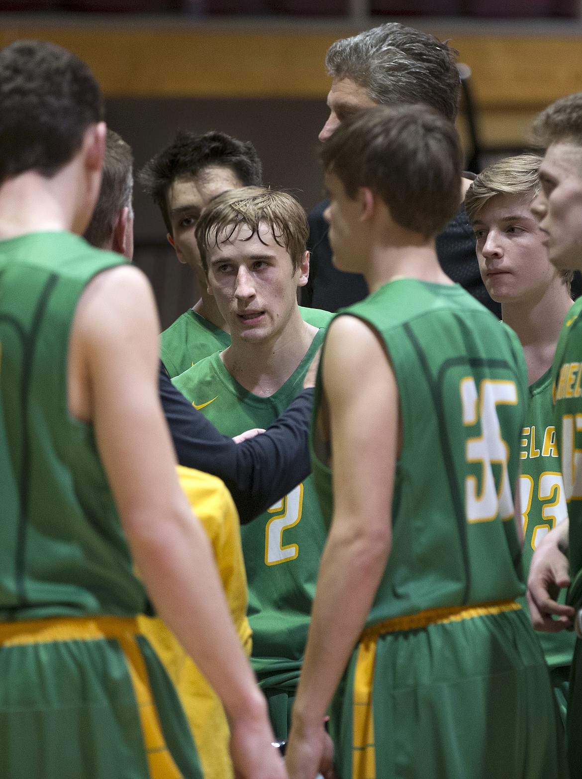 LISA JAMES/PressIan Horne, center, and his Lakeland teammates take a timeout in the last seconds of their 4A Region 1 championship game against Moscow at NIC on Thursday night. Lakeland lost to Moscow, 44-45.