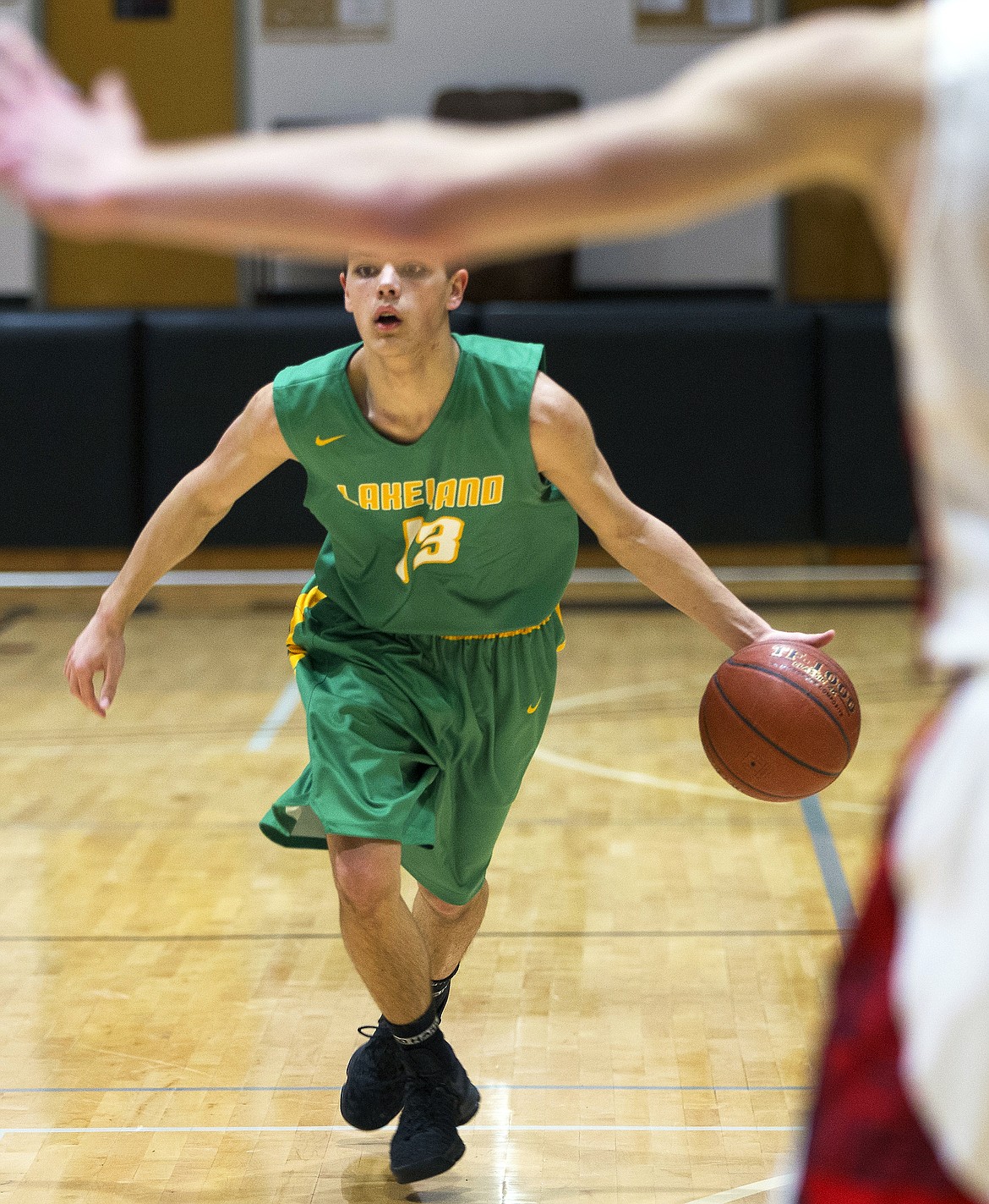 LISA JAMES/PressDylan Vahey of Lakeland looks to pass during their 4A Region 1 championship game against Moscow at NIC on Thursday night. Lakeland lost to Moscow, 44-45.