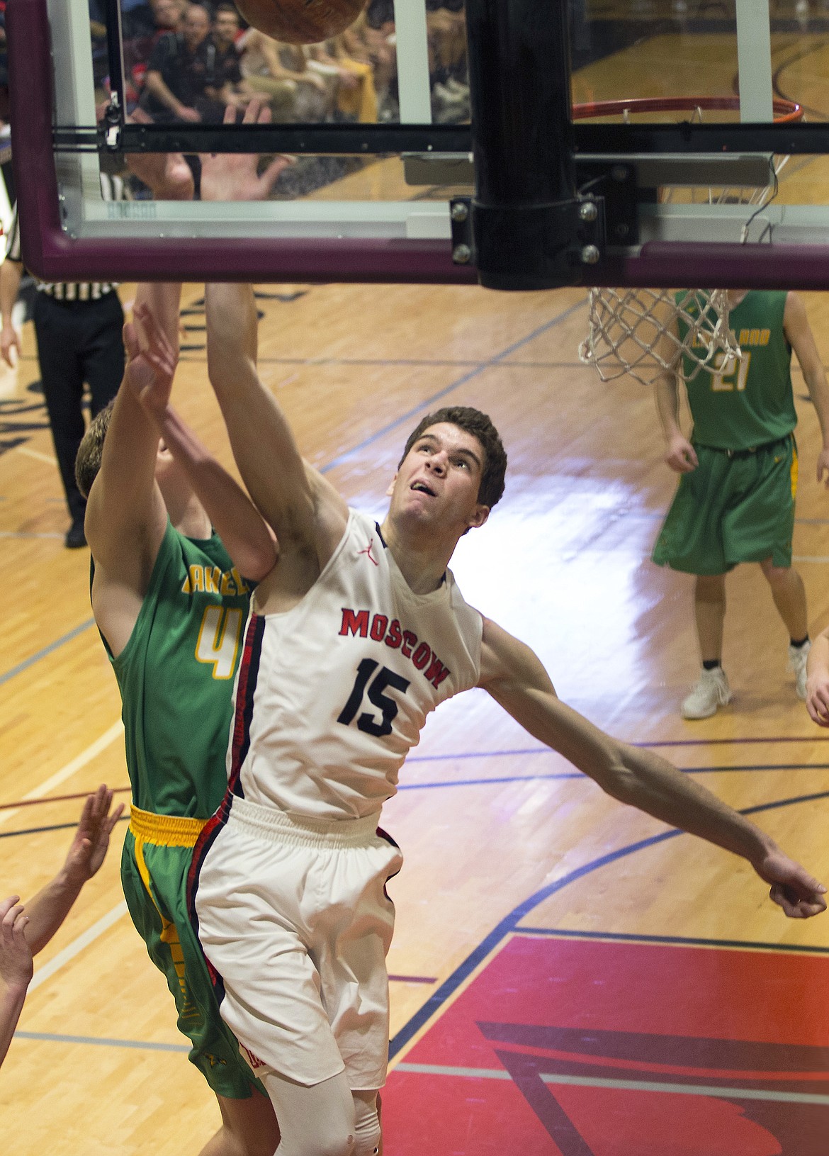 LISA JAMES/PressHunter Pickard of Moscow tries to swat the ball from Josiah Haaland of Lakeland during their 4A Region 1 championship game at NIC on Thursday night.