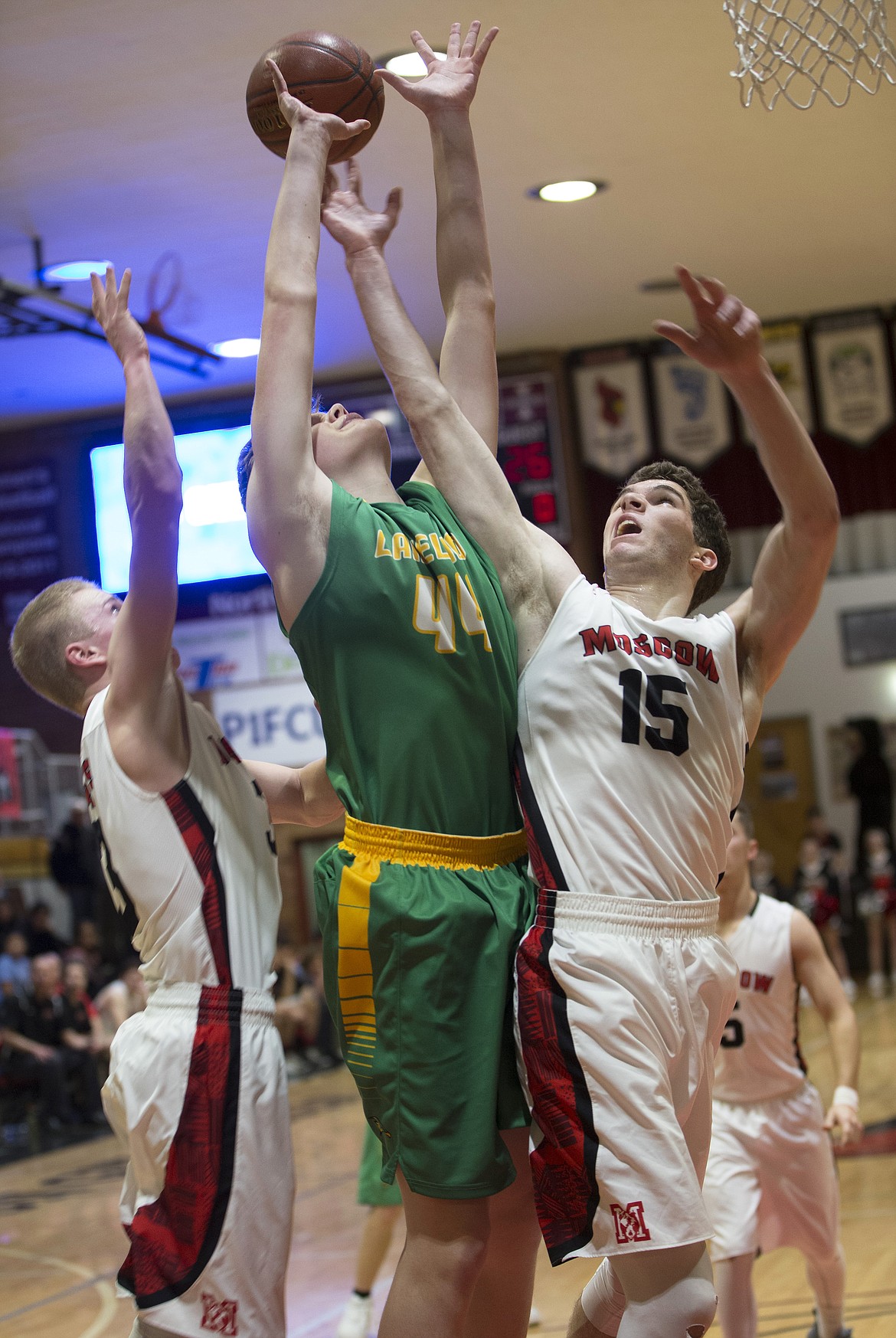 LISA JAMES/PressJosiah Haaland of Lakeland, is blocked by Moscow players in the last half of their 4A Region 1 championship game at NIC on Thursday night. Lakeland lost to Moscow, 44-45.