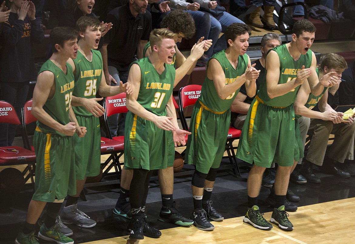 LISA JAMES/PressLakeland players cheer for their teammates in the last minutes of their 4A Region 1 championship game against Moscow at NIC on Thursday night. Lakeland lost to Moscow, 44-45.