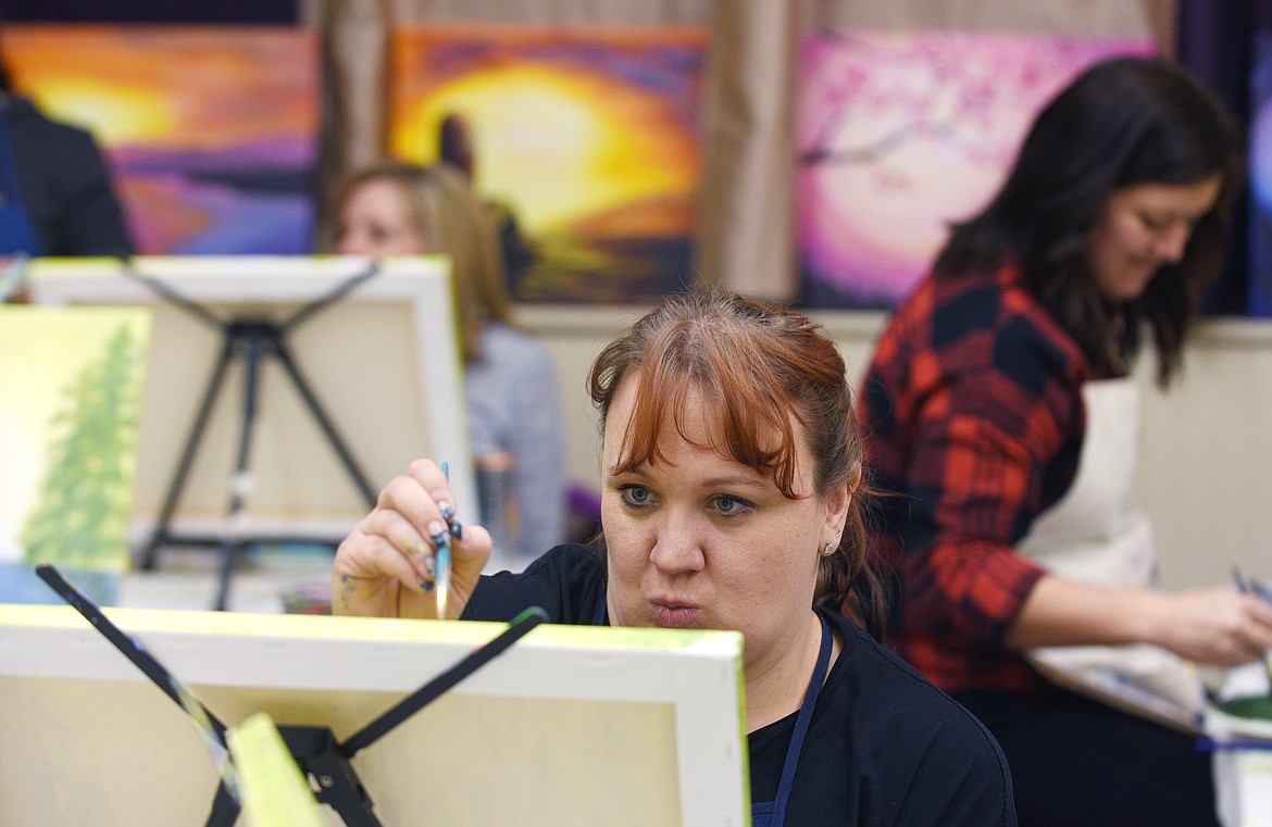 Sarah Marsh focuses on the details of her painting at Tipsy Brush in January.