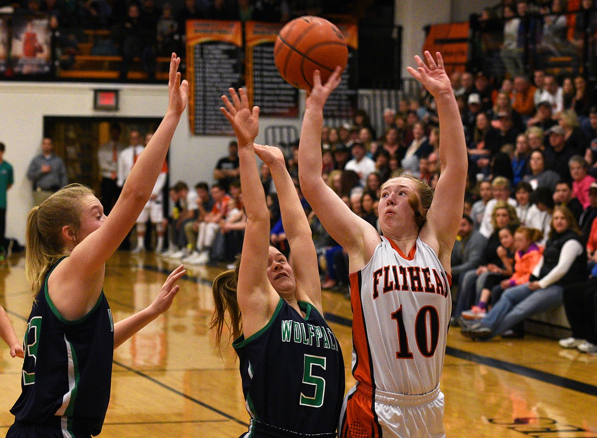 Flathead guard Kylee Meredith is fouled by Glacier Guard Cadie Williams as she puts up a shot in the fourth quarter at Flathead on Thursday. Meredith led the Bravettes with 20 points in the 39-34 victory. (Aaric Bryan/Daily Inter Lake)