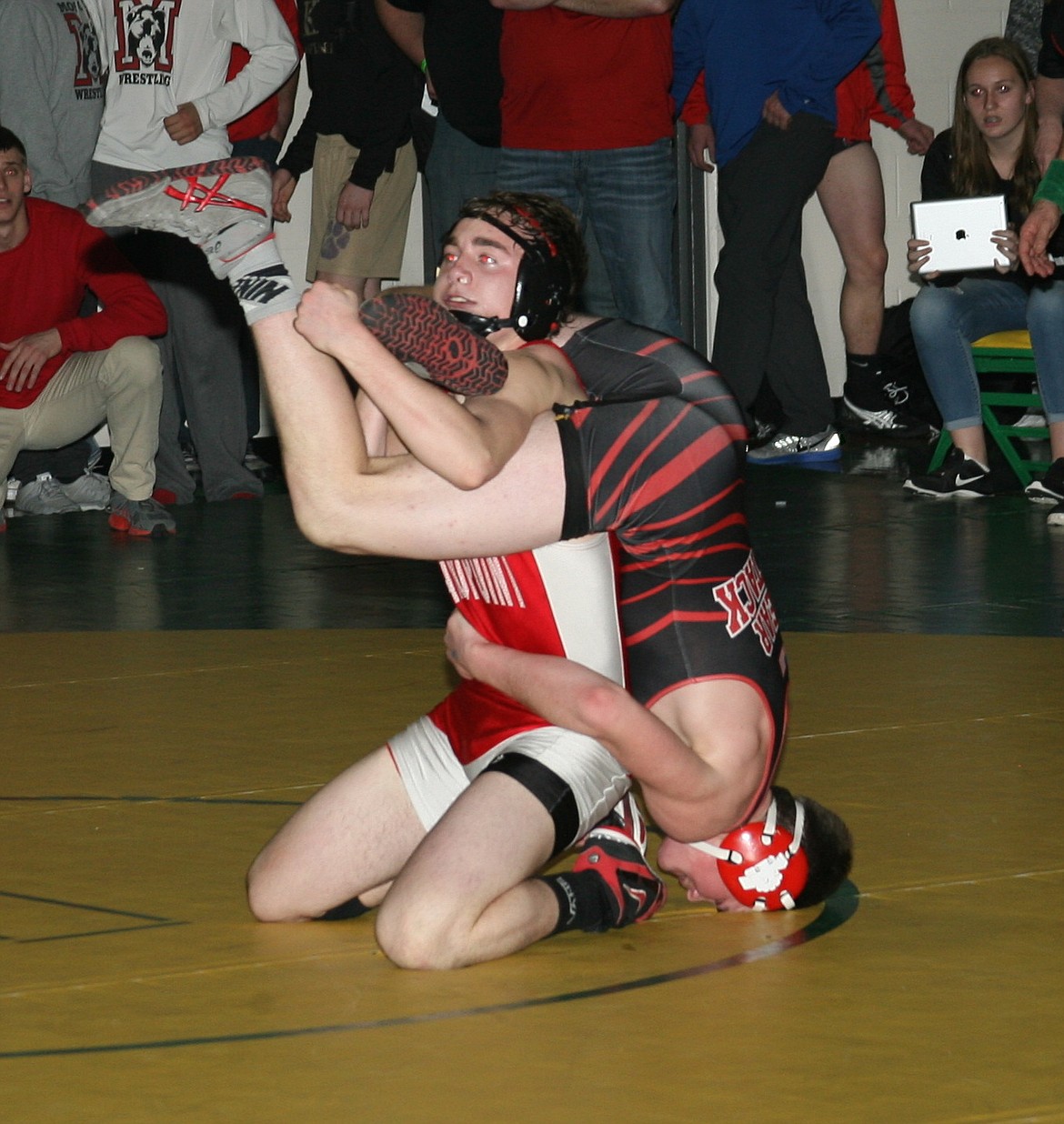 (Photo by ERIC PLUMMER)
Sandpoint senior Preston Bunty, left, is the No. 5 ranked 152 pound wrestler in the 4A ranks. The steady Bunty has the most wins on the season for the Bulldogs.